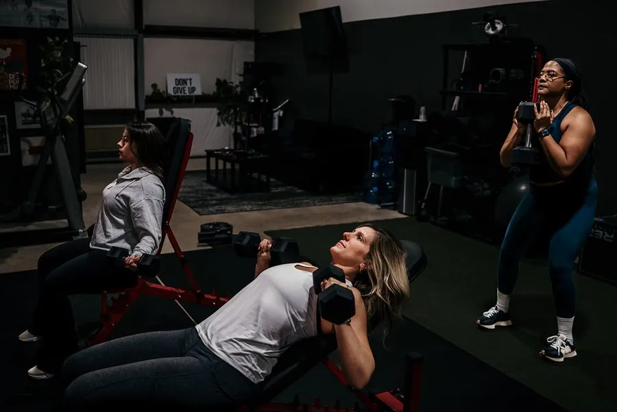 Small group coaching class training with dumbbells at Anew Training in Dover, DE